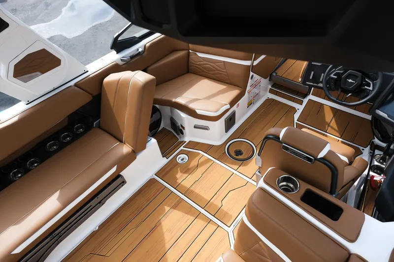 Slide: The Image of Luxurious interior of 2026 Supra SL boat with brown leather seating and sleek design. - 18