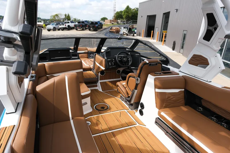 Slide: The Image of Luxurious 2026 Supra SL boat interior with brown leather seating and modern dashboard. - 22