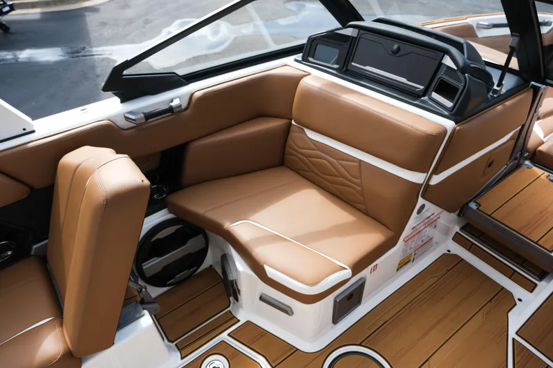 Slide: The Image of 2026 Supra SL boat interior with luxurious tan leather seating and modern dashboard design. - 23