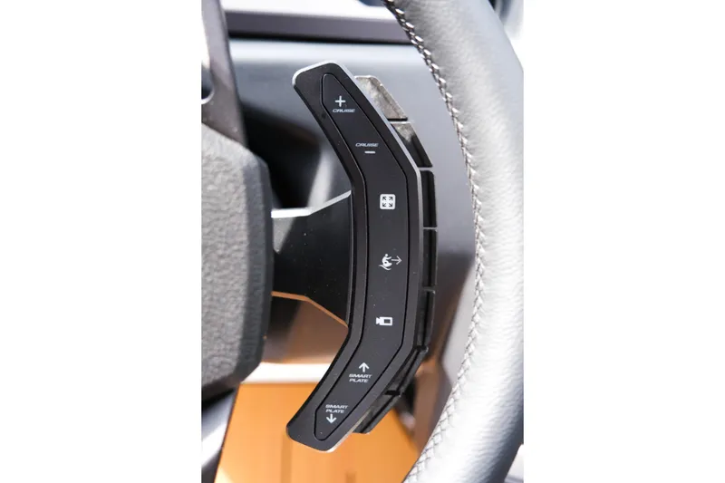 Slide: The Image of Steering wheel controls of 2026 Supra SL, featuring cruise and smart features. - 31