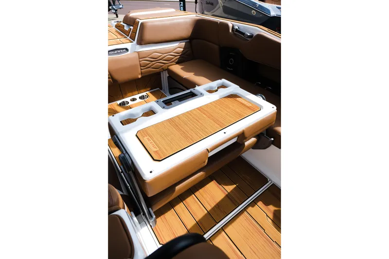 Slide: The Image of 2026 Supra SL boat interior with luxurious tan seating and wooden accents. - 37
