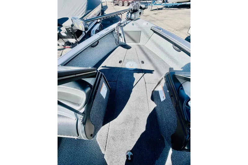 Slide: The Image of 2026 Lund 2075 Fisherman boat interior with spacious deck and storage compartments. - 14