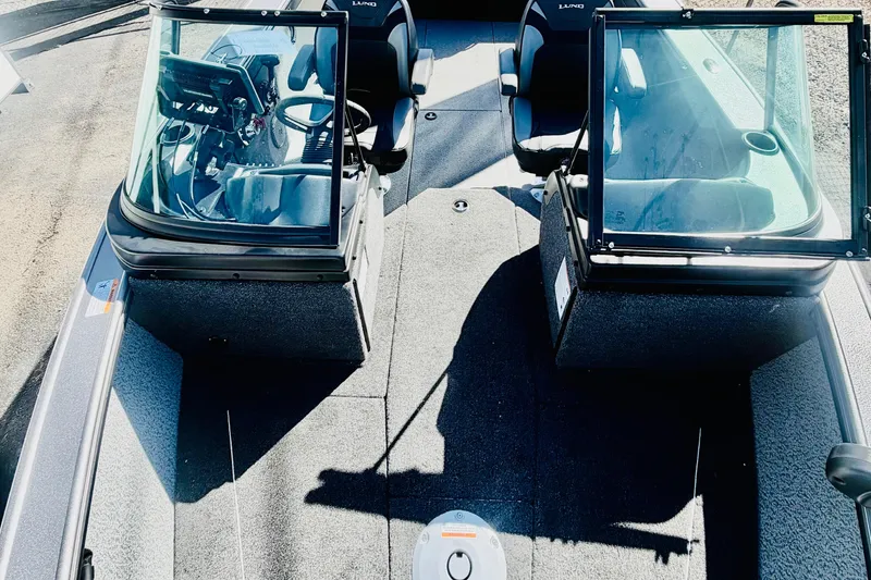 Slide: The Image of 2026 Lund 2075 Fisherman boat interior with dual consoles and seating. - 15