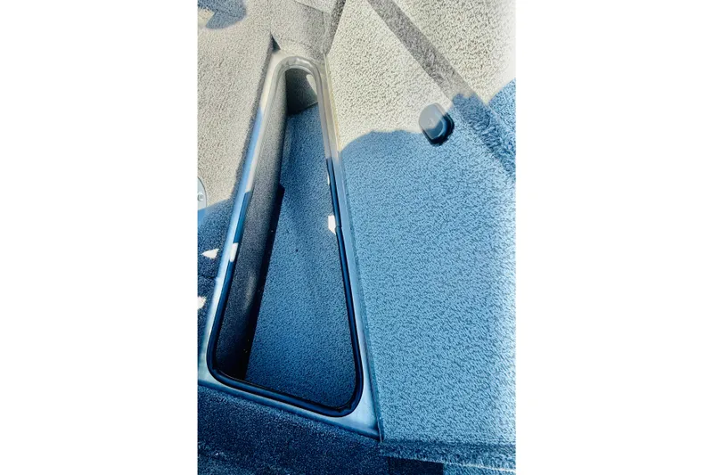 Slide: The Image of Interior view of 2026 Lund 2075 Fisherman boat storage compartment. - 17