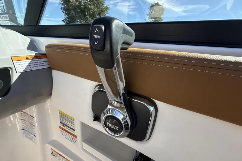 Slide: The Image of Throttle control of 2025 Chaparral 23 SSi boat, featuring trim adjustment. - 16