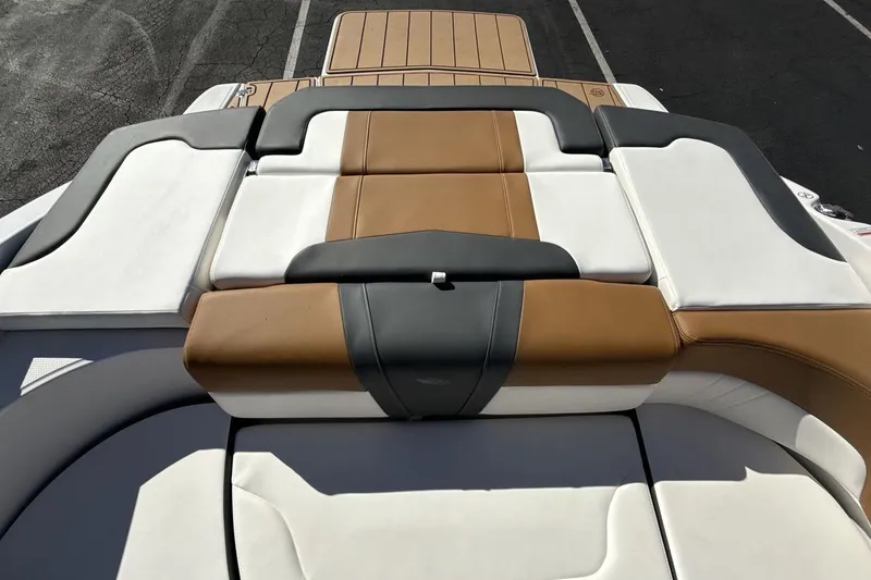 Slide: The Image of 2025 Chaparral 23 SSi boat with luxurious tan and white seating. - 19