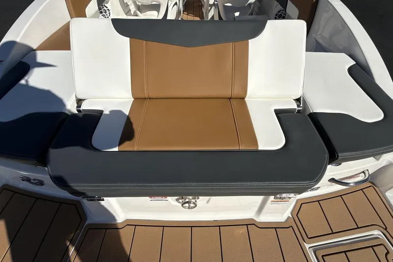 Slide: The Image of 2025 Chaparral 23 SSi boat seating with tan and white upholstery, modern design. - 22