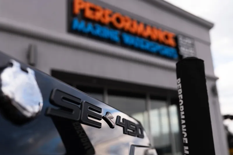 Slide: The Image of 2024 Supra SE badge close-up at Performance Marine Warehouse. - 14