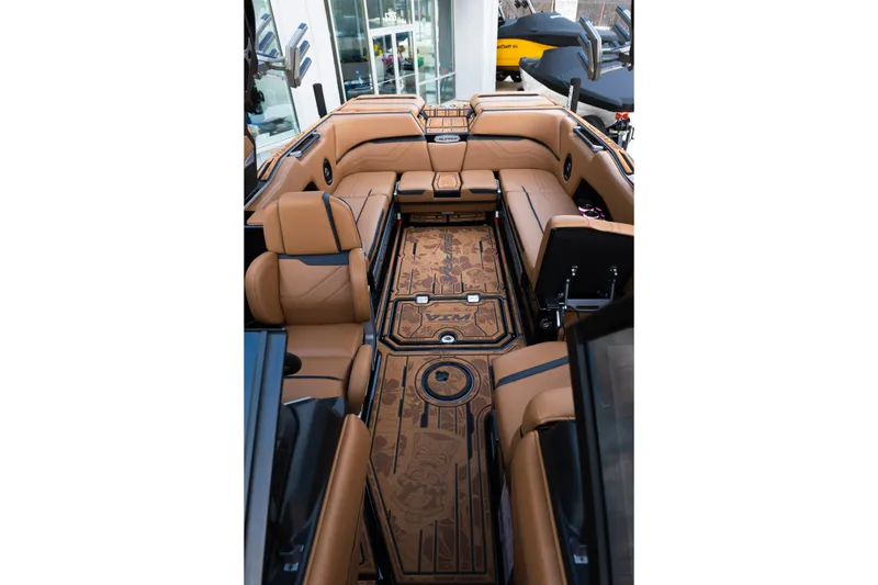 Slide: The Image of Luxurious interior of 2024 Supra SE boat with tan leather seating and detailed flooring. - 24