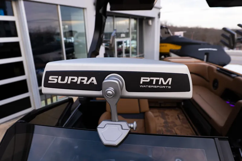 Slide: The Image of 2024 Supra SE boat with PTM Watersports mirror, showcasing luxury interior. - 25