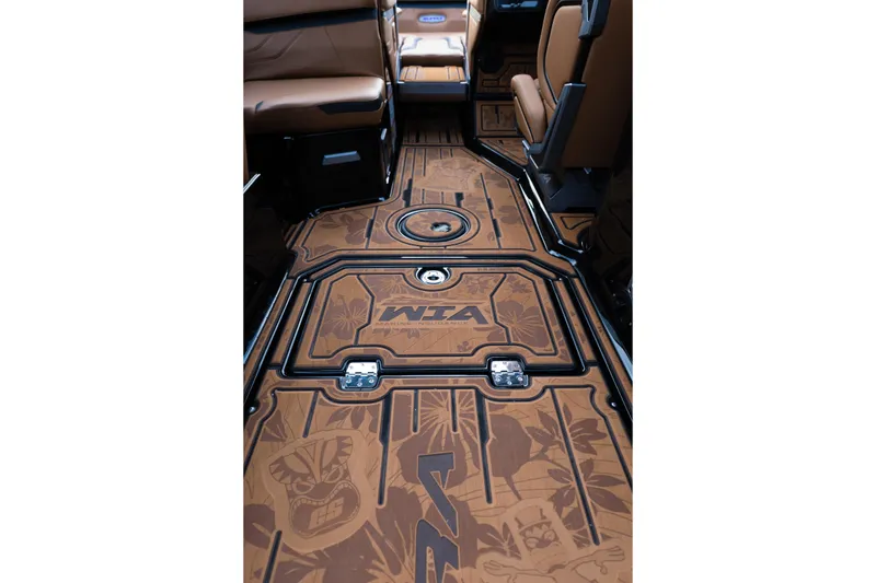 Slide: The Image of 2024 Supra SE interior with custom brown floor design and WTA branding. - 29