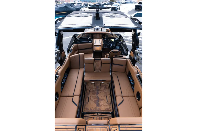 Slide: The Image of Luxurious interior of 2024 Supra SE boat with tan leather seating and modern dashboard. - 34