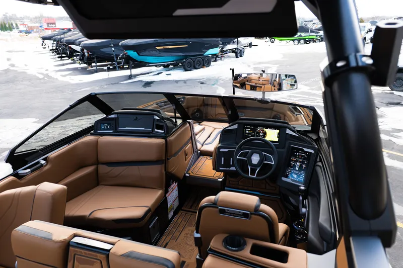 Slide: The Image of 2024 Supra SE boat interior with luxurious seating and advanced dashboard technology. - 35