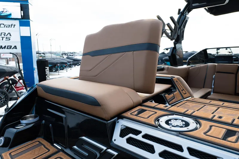 Slide: The Image of 2024 Supra SE boat interior with tan and black seating, showcasing luxury design. - 40