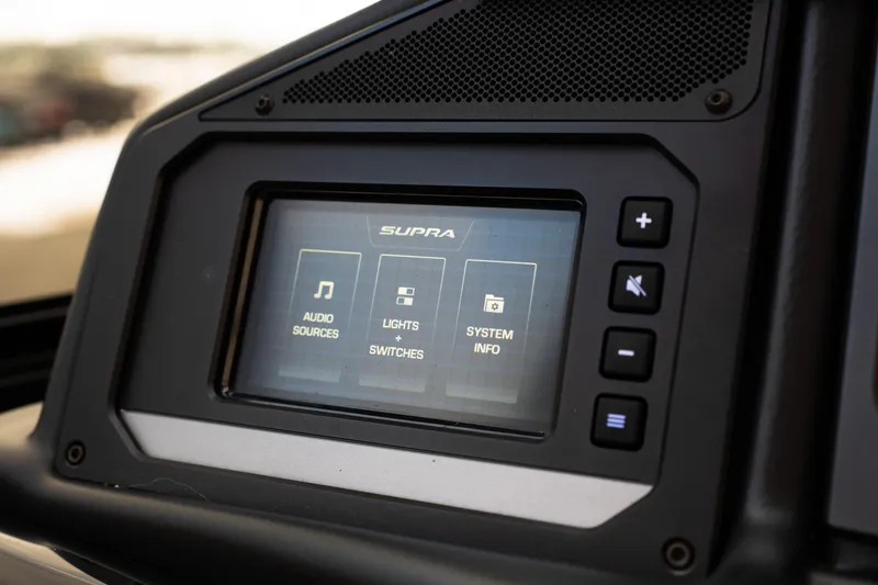 Slide: The Image of 2024 Supra SE dashboard touchscreen displaying audio, lights, and system info options. - 45