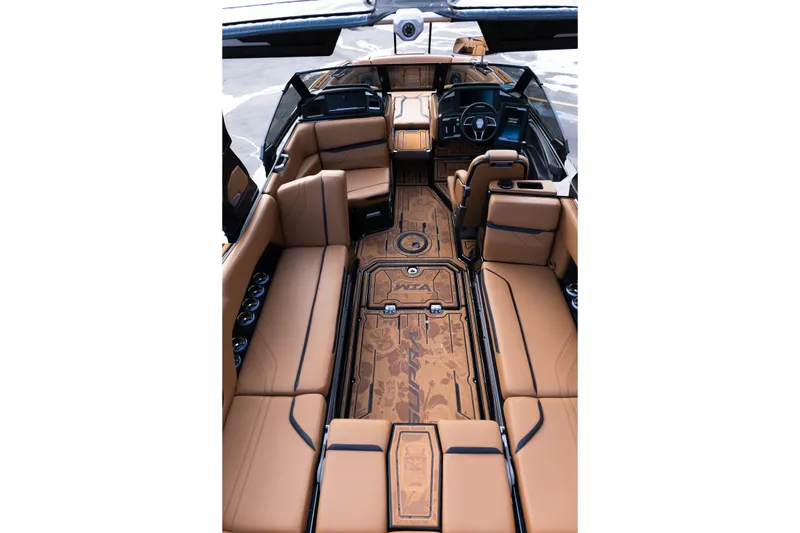 Slide: The Image of Luxurious interior of 2024 Supra SE boat with tan leather seating and detailed flooring. - 46