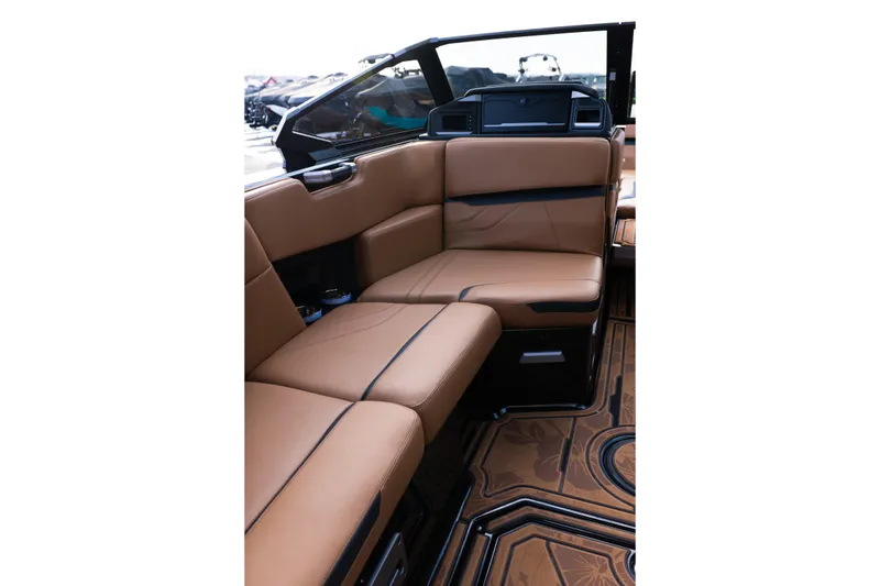 Slide: The Image of 2024 Supra SE interior with luxurious brown leather seating and stylish design. - 51