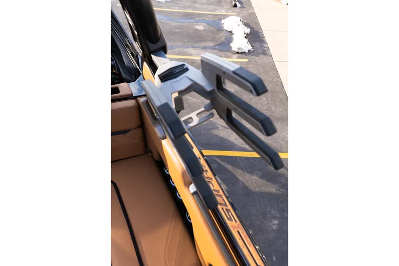 Slide: The Image of 2024 Supra SE interior with sleek tan seating and advanced equipment. - 52