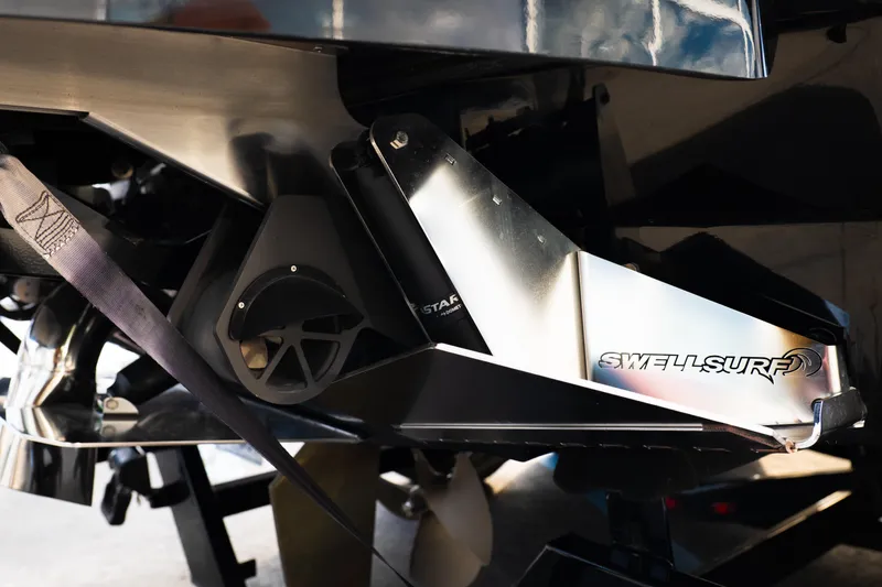 Slide: The Image of 2024 Supra SE boat with Swell Surf system, close-up view. - 55