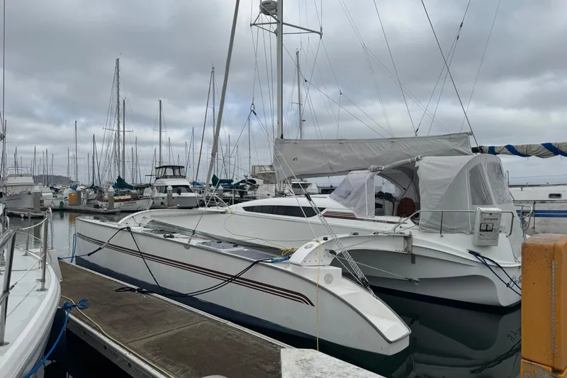 Slide: The Image of 2016 Dragonfly 32 sailboat docked at a marina with overcast skies. - 1