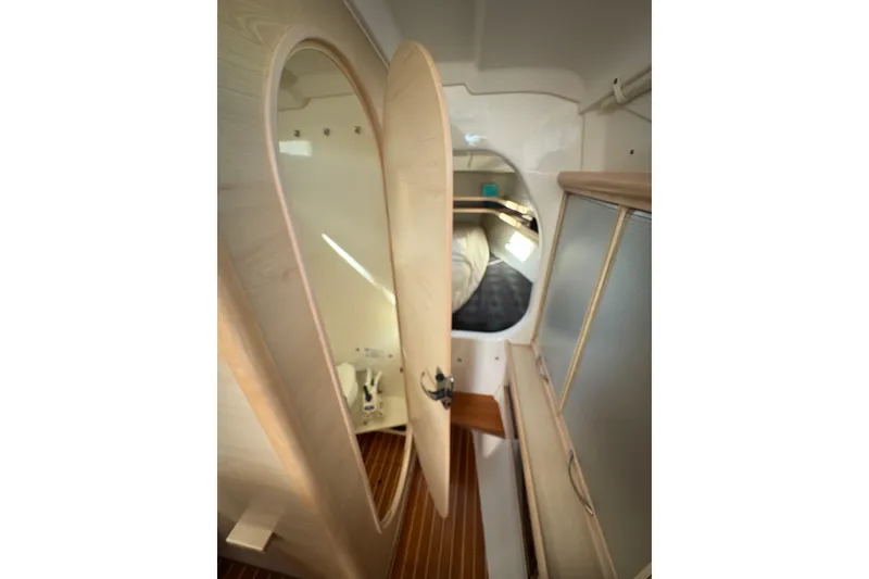 Slide: The Image of Interior of 2016 Dragonfly 32 sailboat with control panel and storage cabinets. - 9
