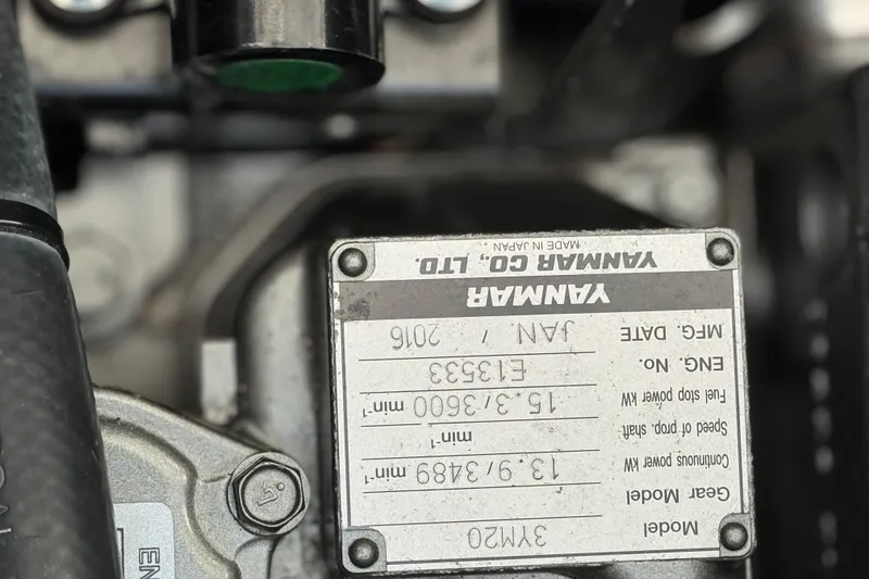 Slide: The Image of Close-up of a Yanmar engine label on a 2016 Dragonfly 32 model. - 11