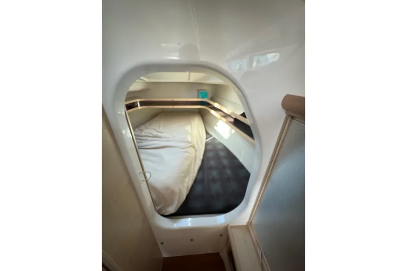 Slide: The Image of Cozy cabin interior of 2016 Dragonfly 32 sailboat with bed and storage. - 20