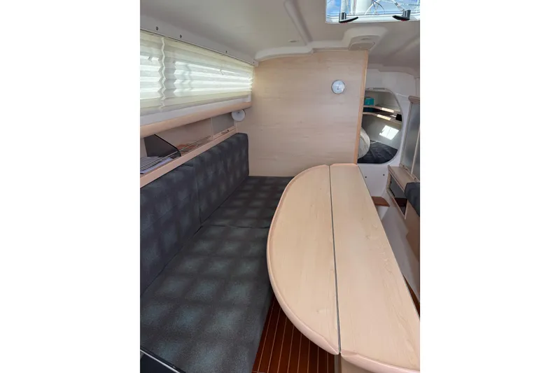 Slide: The Image of Interior of 2016 Dragonfly 32 sailboat with seating and table, featuring modern design. - 23