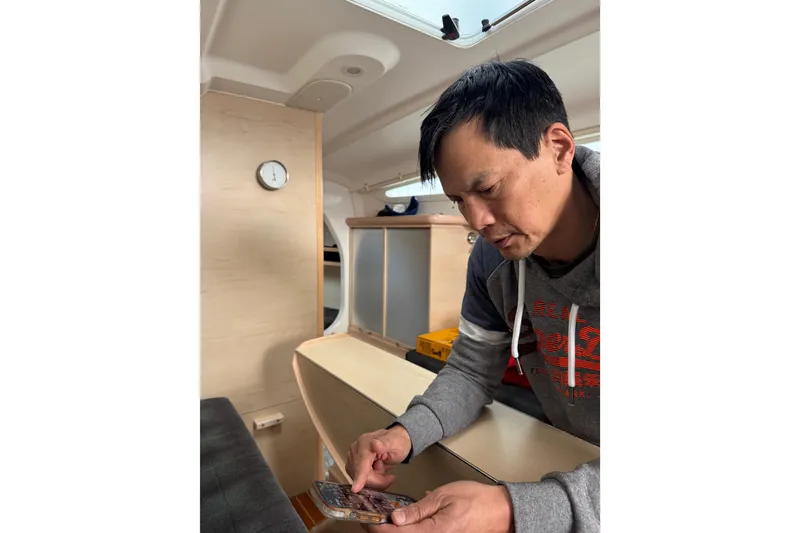 Slide: The Image of Interior of 2016 Dragonfly 32 with cushioned seating and light wood paneling. - 6