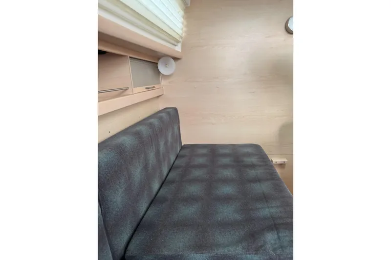 Slide: The Image of Compact kitchen area in a 2016 Dragonfly 32, featuring a sink and storage cabinets. - 7