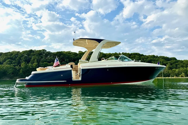 The Image of 2019 Chris-Craft Launch 28 GT boat on calm water, scenic background. - 0