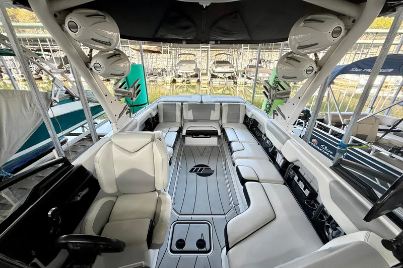 Slide: The Image of 2021 Malibu Wakesetter 25 LSV interior with spacious seating and premium audio system. - 19