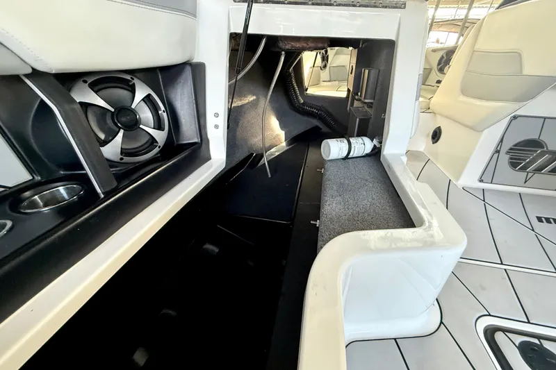 Slide: The Image of 2021 Malibu Wakesetter 25 LSV interior with speaker and seating area. - 27