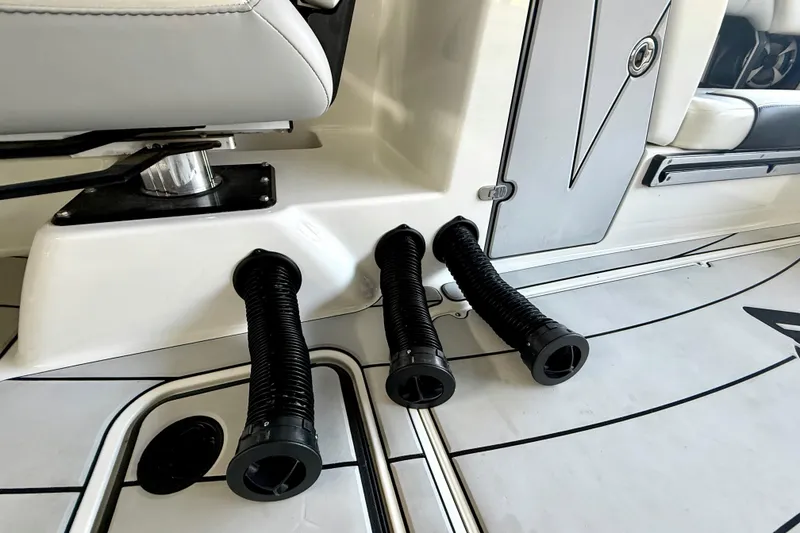 Slide: The Image of 2021 Malibu Wakesetter 25 LSV interior with black hoses and seating details. - 28