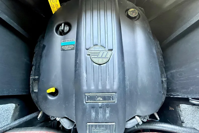 Slide: The Image of 2021 Malibu Wakesetter 25 LSV engine compartment, featuring Monsoon engine cover. - 31