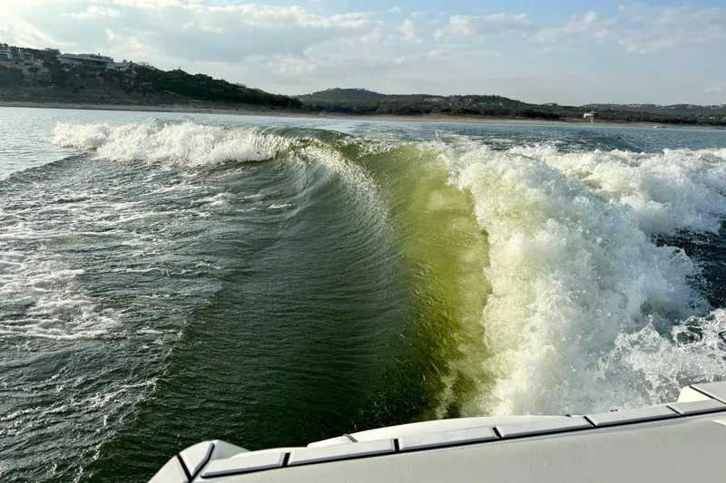 Slide: The Image of Wake created by 2021 Malibu Wakesetter 25 LSV on a sunny lake. - 35