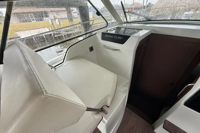 Slide: The Image of Interior of 2020 Beneteau Antares 9 boat, featuring helm seat and dashboard. - 13