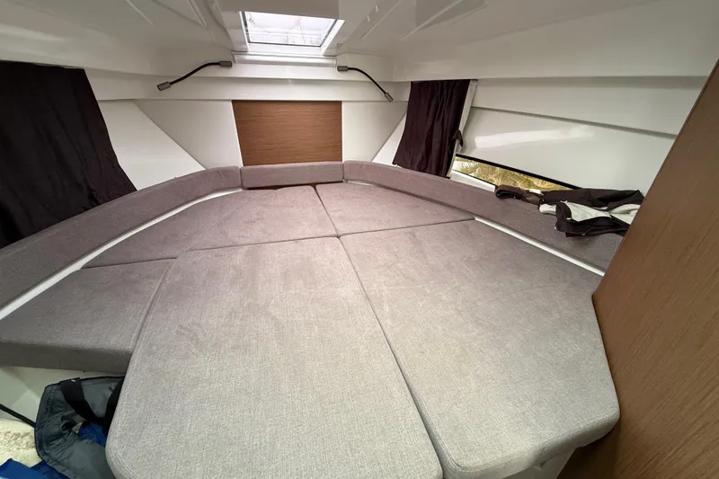 Slide: The Image of Interior cabin of 2020 Beneteau Antares 9 with spacious bed and modern design. - 18