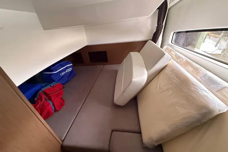 Slide: The Image of Interior cabin of 2020 Beneteau Antares 9 with cushions and storage bags. - 19