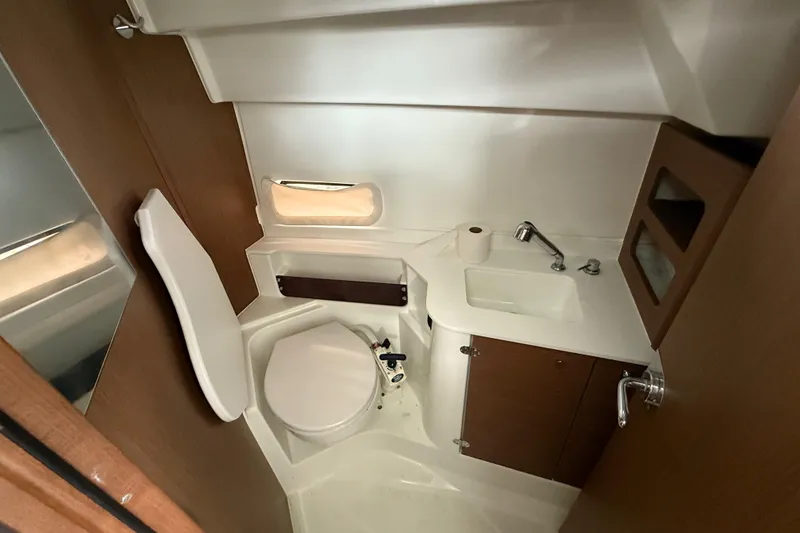 Slide: The Image of Bathroom interior of 2020 Beneteau Antares 9 boat with toilet and sink. - 21