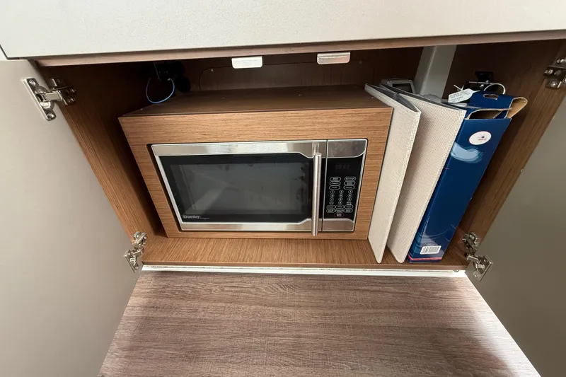 Slide: The Image of Microwave in Beneteau Antares 9 yacht cabinet, 2020 model, with storage space. - 23