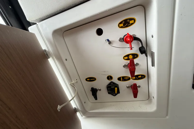 Slide: The Image of Control panel of a 2020 Beneteau Antares 9 boat with switches and labels. - 24