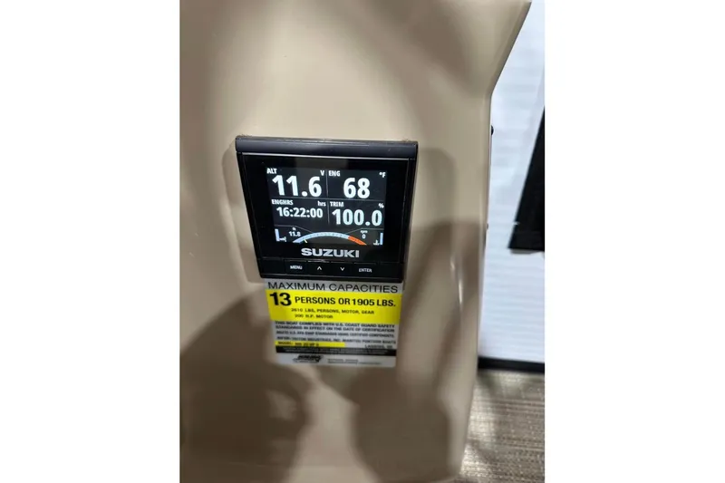 Slide: The Image of Suzuki engine display on 2022 Manitou 25 AURORA LE RF, showing capacity for 13 people. - 8