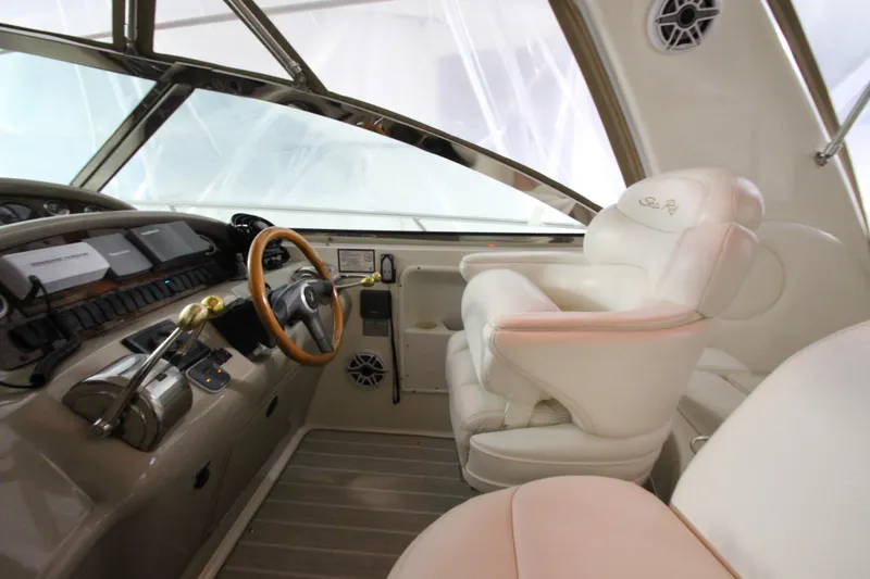 Slide: The Image of Cockpit of 2000 Sea Ray 410 Sundancer with steering wheel and controls. - 13