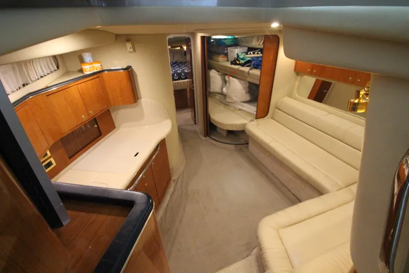 Slide: The Image of Luxurious interior of 2000 Sea Ray 410 Sundancer yacht with elegant seating and cabinetry. - 20