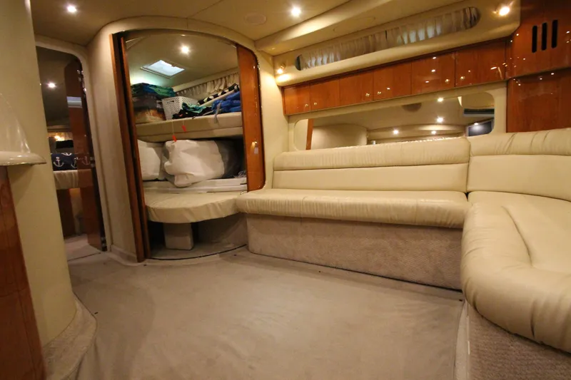 Slide: The Image of Luxurious interior of 2000 Sea Ray 410 Sundancer yacht with plush seating and elegant design. - 26