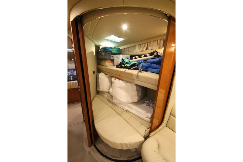 Slide: The Image of Interior cabin of 2000 Sea Ray 410 Sundancer with bunk beds and storage. - 28
