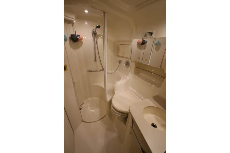 Slide: The Image of Bathroom interior of 2000 Sea Ray 410 Sundancer yacht, featuring shower and sink. - 39