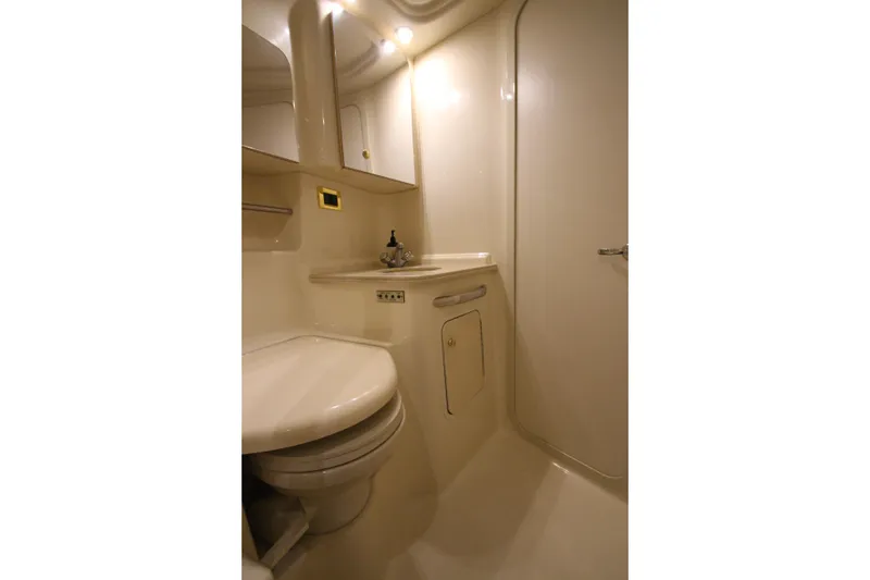 Slide: The Image of Luxurious bathroom in 2000 Sea Ray 410 Sundancer yacht, featuring modern fixtures and elegant design. - 40