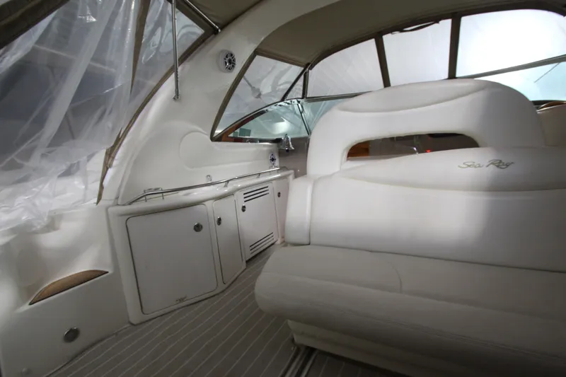 Slide: The Image of Interior of a 2000 Sea Ray 410 Sundancer yacht with white seating and cabinetry. - 5